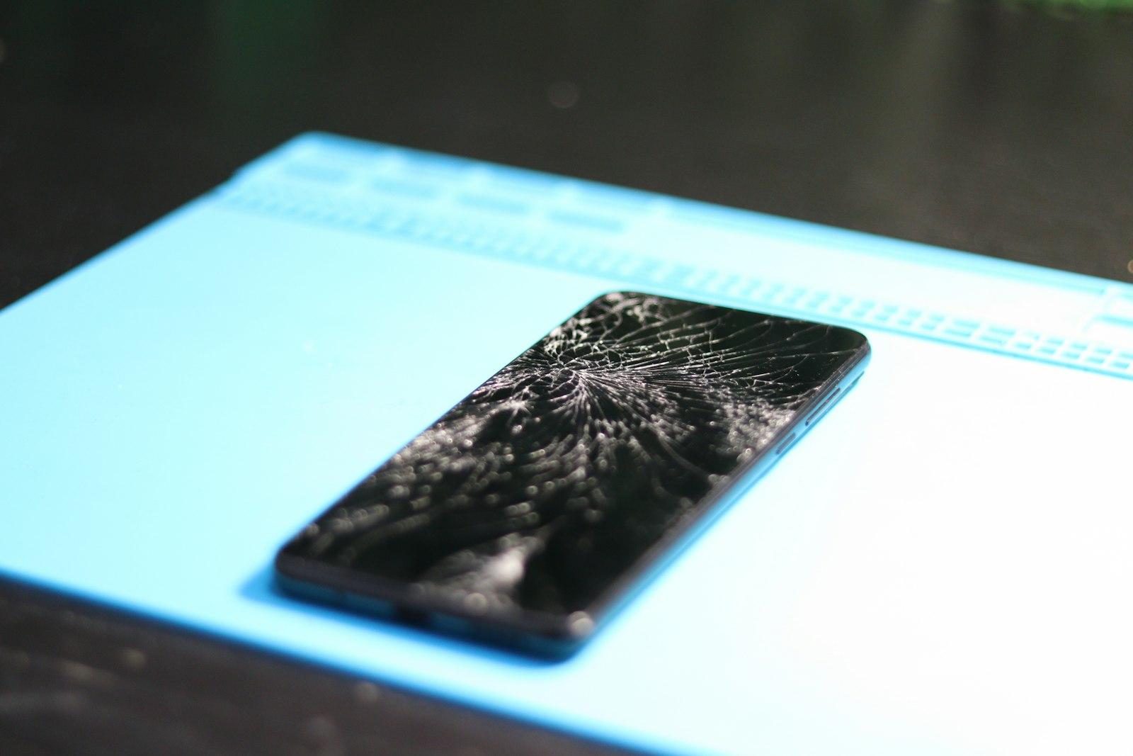 Cracked smartphone screen closeup before repair